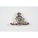 A DIAMOND AND ENAMEL REGIMENTAL BROOCH FOR THE ROYAL ARTILLERY set with rose-cut diamonds, and