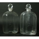 A PAIR OF EARLY 19TH CENTURY DECANTERS AND STOPPERS of flattened hexagonal form, bullseye stopper