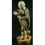 A ROYAL WORCESTER FIGURE OF THE YOUNG MOZART, model 1847, date cipher for 1931, in a pale blue