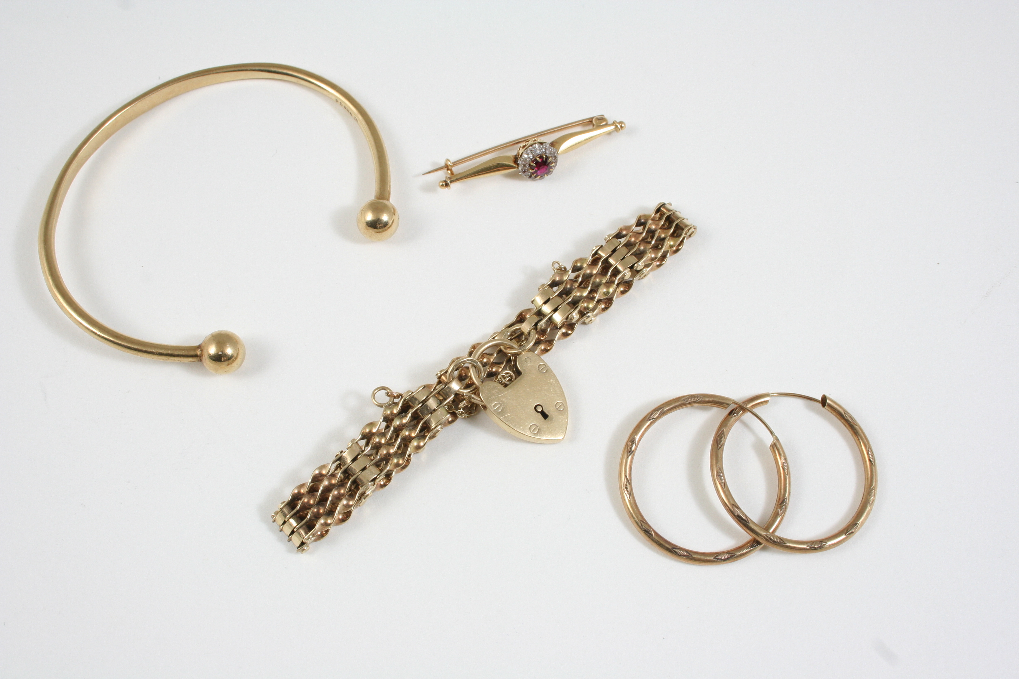 A 9CT. GOLD GATE LINK BRACELET with padlock clasp, 12 grams, together with a ruby and diamond