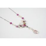 A CULTURED PEARL NECKLACE set with graduated assorted cultured pearls, on a silver fine link