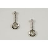A PAIR OF DIAMOND DROP EARRINGS set with circular-cut diamonds weighing approximately 1.03 and 1.