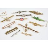 TWELVE ASSORTED GOLD AND GEM SET BROOCHES including one formed as a dragonfly and set with an
