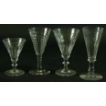 A MATCHED PART SET OF DRINKING GLASSES, mainly 19th century, each with faceted decoration, mainly