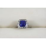 AN ART DECO SAPPHIRE AND DIAMOND RING the square-shaped sapphire is set within a surround of