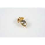 A DIAMOND AND GOLD FLORAL BROOCH the fancy coloured foil backed diamond weighs approximately 2.50
