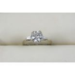 A DIAMOND SOLITAIRE RING the brilliant-cut diamond weighs 2.02 carats and is set with a tapered