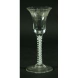 AN EIGHTEENTH CENTURY WINE GLASS, the bell shaped bowl with engraved fruiting vine and bird