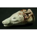 AN ENGLISH PEARLWARE STIRRUP CUP in the form of a fox mask, later 18th Century, decorated in