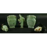 A PAIR OF CHINESE JADE STYLE VASES, of flattened ovoid form, with floral carving and ring handles,