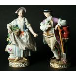 A PAIR OF MEISSEN GARDENER FIGURES incised '668' with blue crossed sword marks. Height 18.5cm (2).