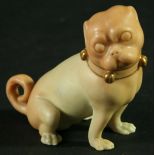 A ROYAL WORCESTER BLUSH IVORY FIGURE OF A PUG DOG, date cipher for 1916, seated on its haunches,