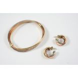 A 9CT. THREE COLOUR GOLD HALF HINGED BANGLE 11 grams, together with a pair of 9ct. three colour gold