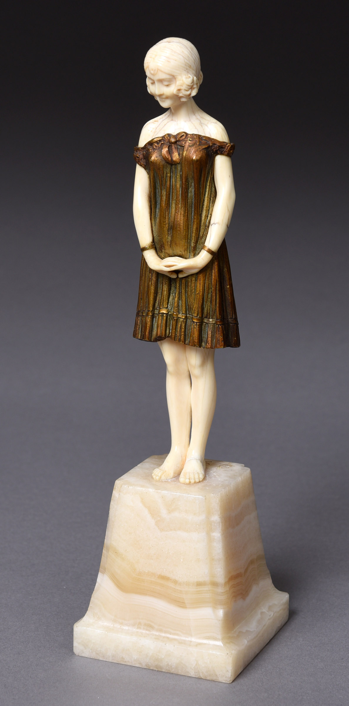 D.H.CHIPARUS - ART DECO BRONZE & IVORY FIGURE a bronze and ivory figure Innocence, the figure