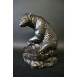 A LARGE BRETBY BEAR a large seated Bear in a black and bronze effect glaze, the hollow figure with