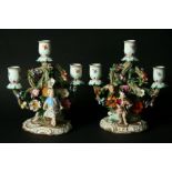 A PAIR OF MEISSEN THREE-LIGHT CANDELABRA late 19th Century, modelled as children before floral