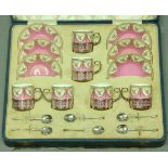 A ROYAL WORCESTER COFFEE SET with printed floral decoration on a pink ground with silver mounts