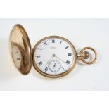 A 9CT. GOLD FULL HUNTING CASED POCKET WATCH BY WALTHAM the signed white enamel dial with Roman