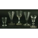 A COLLECTION OF DRINKING GLASSES, mainly 18th and 19th century, of various forms including folded