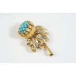 A DIAMOND AND TURQUOISE FLORAL BROOCH BY KUTCHINSKY the flower head set with circular turquoise