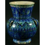 A MIDDLE EASTERN VASE, of baluster form, with three loop handles and stylised floral decoration;