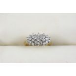 A DIAMOND CLUSTER RING the circular-cut diamonds weigh approximately 0.50 carats in total and are