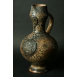 AN ENGLISH SALT GLAZED STONEWARE FLAGON of ovoid form with applied mask to neck and circular