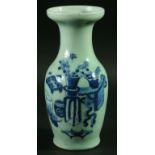 A CHINESE VASE, of broad mouthed baluster form, blue painted with a table and vases on a celadon