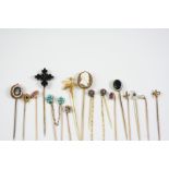 FIFTEEN ASSORTED GOLD AND GEM STICK PINS including one mounted with an oval shell cameo of a bearded