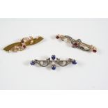 A VICTORIAN SAPPHIRE, DIAMOND AND PEARL BROOCH of scrolling form, set with oval-shaped sapphires,