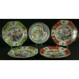 A CHINESE CANTON STYLE PLATE, 19th century, painted with four figures outside a pagoda, inside a