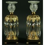 A PAIR OF ORMOLU AND GLASS LUSTRES, the glass scones above gilt metal vine leaves and grapes,