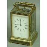 A GILT BRASS FOUR PANE CARRIAGE CLOCK the enamel dial inscribed Lambert, Coventry St., London,