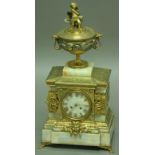 A FRENCH MANTLE CLOCK, late 19th century, the 4" marble dial with gilt roman numerals, brass eight