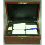 A VICTORIAN LEATHER AND BRASS BOUND WRITING BOX by Needs & Bramah with fitted interior and leather
