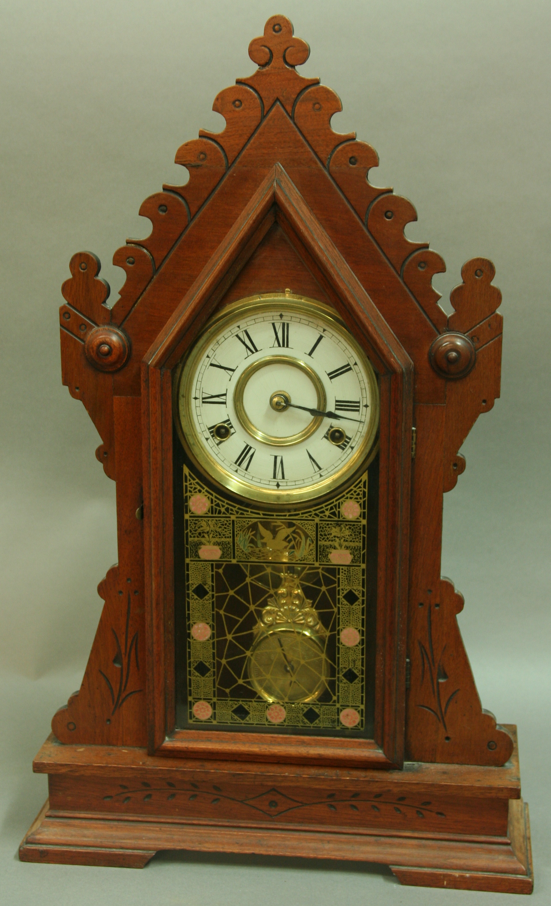 AN AMERICAN 'GINGERBREAD' CLOCK,  late 19th century, 4 1/2" white dial on a two train movement