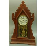 AN AMERICAN 'GINGERBREAD' CLOCK,  late 19th century, 4 1/2" white dial on a two train movement