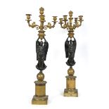 A PAIR OF EMPIRE BRONZE AND ORMOLU CANDELABRA for five lights, held up by a winged female figure