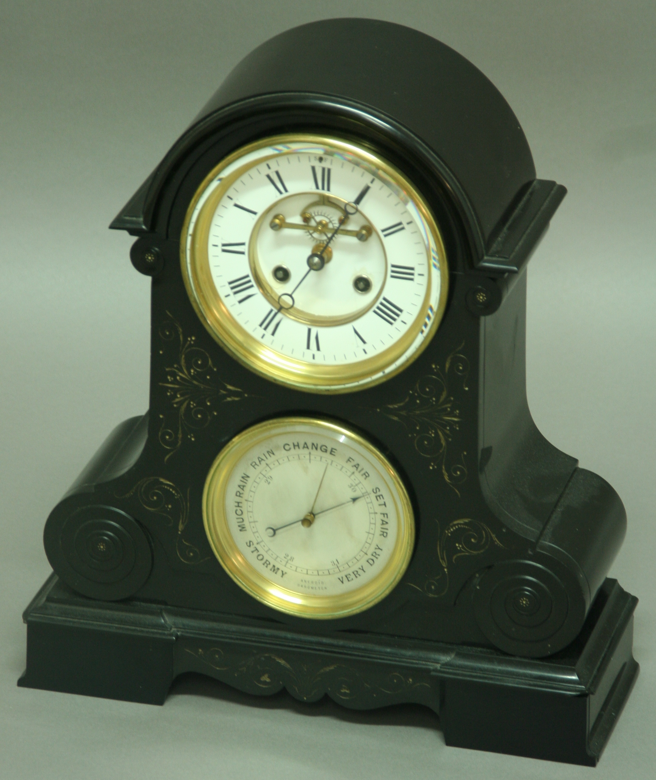 A BLACK MARBLE MANTLE CLOCK, late 19th century, with 5 1/2" enamelled dial with exposed escapement