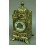 A FRENCH BRASS MANTEL CLOCK 3 3/4" ivorine dial with arabic numerals on a brass Japy Freres eight