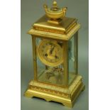 A FRENCH ORMOLU FOUR PANE MANTLE CLOCK, later 19th century, 10cm gilt dial inscribed 'W Box & Co,