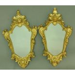 PAIR OF 19TH CENTURY GILT GESSO GIRANDOLES the scrolling frames surmounted by masks (lacking