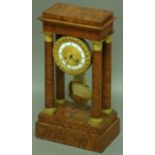 A FRENCH BURR WALNUT AND ORMOLU MOUNTED PORTICO CLOCK, the 4 1/2" enamelled chapter ring with engine
