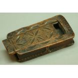 A 19TH CENTURY CHIP CARVED SNUFF BOX in the form of a book with sliding cover. Length 12.5cm.