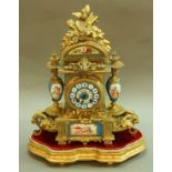 A FRENCH MANTEL CLOCK gilt metal case with porcelain dial, urns and plaque with Japy Freres brass
