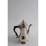 A GEORGE III PLAIN BALUSTER COFFEE POT with a spreading foot, domed cover & knop finial, by Thomas