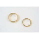 AN 18CT. GOLD WEDDING BAND 5.8 grams, size S, together with another 18ct. gold wedding band, 3.2
