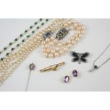 A QUANTITY OF JEWELLERY including a double row graduated cultured pearl necklace, set to a blue