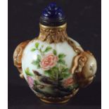 CHINESE PORCELAIN AND GILT METAL MOUNTED SNUFF BOTTLE, of melon form with elephant head handles