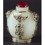 A PAIR OF CHINESE MUTTON FAT JADE AND WHITE METAL MOUNTED SNUFF BOTTLES, of flattened ovoid form